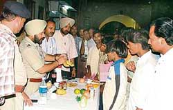 An RPF team shows drug-laced fruits in Ludhiana railway station