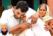 Family members of Mohan Singh (inset), who died in the UK recently under mysterious circumstances, break down at Madan Pur Chalheri village, near Rajpura, on Saturday.