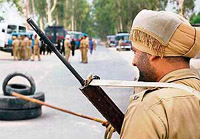A policeman on duty near Dera Salabatpura in Bathinda on Saturday.