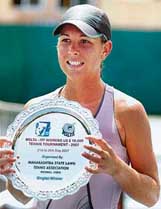 Marinne Giraud holds the trophy after defeating Rushmi Chakravarthi in the final of the ITF Womens Circuit Tennis Tournament in Mumbai on Saturday. Giraud won 7-6, 6-2. 