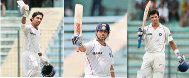 Dinesh Karthik (left), Sachin Tendulkar (centre) and Rahul Dravid celebrate on completing their hundreds during the second day of the second Test against Bangladesh at the Sher-e-Bangla National Cricket Stadium at Mirpur in Dhaka on Saturday. 