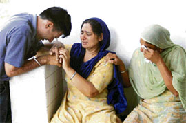 Relatives of Jaspal Kaur break down while waiting for the postmortem report at the civil hospital in Rajpura on Sunday.