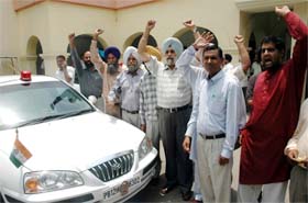 Parents of art and craft teachers protest outside the venue of meeting between the Punjab education minister and DEOs