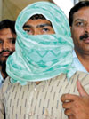 Nandu and Deepak, accused in murder cases, in police custody.