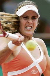 Czech Republics Nicole Vaidisova hits a return against Switzerlands Emmanuelle Gagliardi during their first round French Open match in Paris on Tuesday. Vaidisova won 6-4, 6-3. 