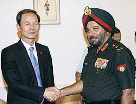 South Korea's defence minister Kim Jang-Soo shakes hands with Indian Army Chief JJ Singh before their meeting in New Delhi on Wednesday. Kim is here on a two-day official visit for first-ever defence ministerial talks between the two nations.