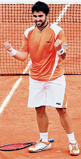 Janko Tipsarevic of Serbia celebrates his victory over Russian Marat Safin after their French Open second round match in Paris on Wednesday. Tipsarevic won 6-4, 6-4, 7-5.