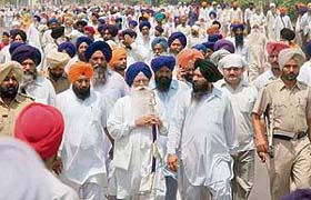 Kirpal Singh Badungar, former SGPC president, leads a march at Fatehgarh Sahib
