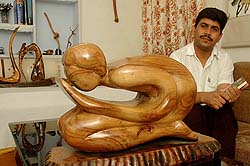 K.S. Nagla, a lecturer at Dr B.R. Ambedkar National Institute of Technology, with his wooden sculptures and drift wood pieces in Jalandhar on Thursday.