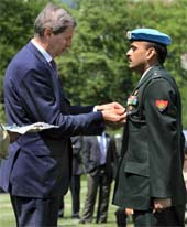 Lieut Col, Praneet Goel (right), currently posted at the United Nations Headquarters in New York, receives the UN Headquarters service medal of honour from Jean-Marie Guehenno, UN Under Secretary-General for peacekeeping operations, at a special ceremony in New York on Wednesday while celebrating the International Peacekeeping Day.