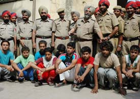 Cops pose for a photograph with the accused in Amritsar. 