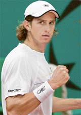 Russias Igor Andreev gestures during the second-round match against Chiles Nicolas Massu during the French Tennis Open in Paris 
