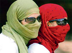 Girls on a two-wheeler cover their faces to protect themselves from extreme heat in Chandigarh on Saturday.