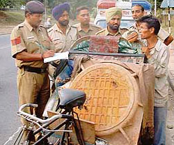 Rickshawpuller Gyan Bahadur nabbed by the police while taking the heritage manhole cover on road dividing Sectors 15 and 24 on Saturday morning.