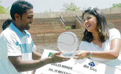 International golfer Irina Brar presents the trophy and a cheque to Prakash Amritraj, winner of the ITF Mens Future Tennis Tournament, at the CLTA, Sector 10, on Saturday.