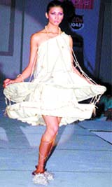 A model displays a creation by students of Wigan Fashion School during the 8th Annual Graduation Fashion Show in the Capital