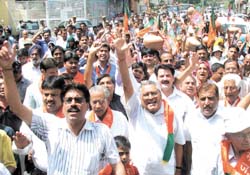 BJP activists shout slogans against Delhi Chief Minister Sheila Dikshit during a demonstration against electricity and water crisis at Patel Nagar in the Capital