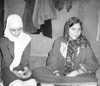 Kulsooma Jan with Iqra, her sister, whom she supports after militants killed their father