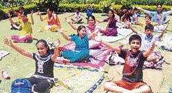Students of Spring Bells DAV Boarding High School participate in a yoga class on the school premises in Ludhiana