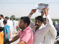 Residents of the Mill Gate area blow whistles and beat utensils to press their demand for setting up a school in the colony at Hisar on Sunday.