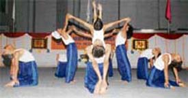 Students of BCM Arya Model Senior Secondary School display yoga asanas at a camp in Ludhiana on Sunday.