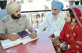 The girl in bridal dress, who was engaged to be married to a cop, gets a complaint registered after the groom and barat did not turn up at the nuptial ceremony, in Amritsar on Sunday.