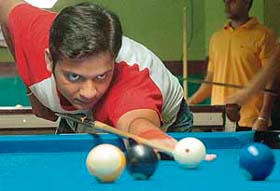 Divya Sharma attempts a shot during Asia Billiards 9 Ball Pool Open Prize Money Tournament in Chandigarh