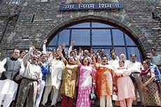 BJP supporters protest in front of the MC building in Shimla on Monday