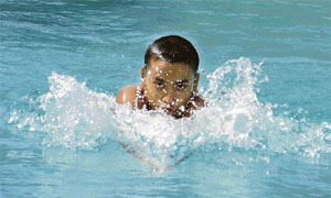 As mercury touches an all-time high this summer, a boy tries to chill in the swimming pool of the Lodhi Club in Ludhiana on Monday.