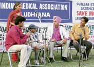 Activists of Bharat Jan Gyan Vigyan Jatha present handbills as part of a programme to creat awareness about environment in Ludhiana on Monday.