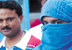 Anil Singh, accused of the murder of a Tata official at the residence of a judge in Patna, at Delhi Police headquarters in the Capital 