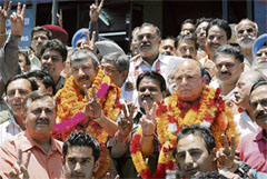 Narinder Kataria (left) and Harish Janartha pose with Congress supporters after taking oath as mayor and deputy mayor, respectively, in Shimla on Tuesday.