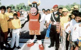 The Military World Games mascot ‘Bravo’ with schoolchildren at Rajpath in New Delhi