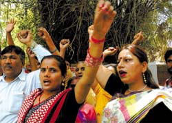 Activists of the Indian Justice Party shout slogans during a protest against the demand by Gujjars for inclusion in the Scheduled Tribes list, at Jantar Mantar in the Capital on Wednesday