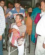 One of the bus passengers is brought to the civil hospital, Kangra, for treatment