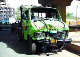The crane carrier after hitting a stationary motorcycle at the IFFCO crossing
