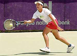 Garima Vatwani in action during the AITA Super Series Tennis Tournament at the CLTA stadium in Sector 10, Chandigarh, on Friday.