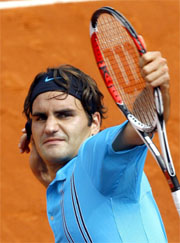 Switzerlands Roger Federer gestures on beating Russias Nikolay Davydenko in the semifinal of the French Open at Roland Garros in Paris on Friday. Federer won 7-5, 7-6, 7-6.