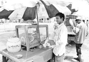 Officially, there is ban on sale of cut fruit. However, unmindful of the order, a vendor sells the cut fruits near bus stand, Karnal, on Sunday.