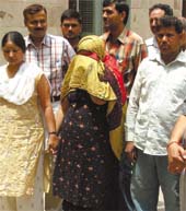 Tabbasum (centre) and Mohd Shamim (right) in custody of the Special Cell of the Delhi Police for being part of an international racket of counterfeit Indian currency in the Capital on Monday.