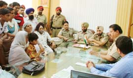 Relatives of the deceased driver, police officials and school director Rajesh Rudra hold a meeting
