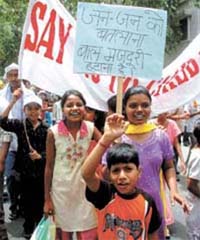 Children participate in a demonstration on the eve of International Anti Child Labour Day in the Capital