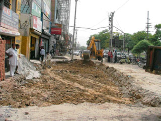 Service lane being developed in Ludhiana on Tuesday.
