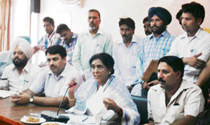Chairperson of the National Commission for Safai Karamcharis Santosh Chaudhary listens to the grievances of scavengers at the circuit house on Tuesday.