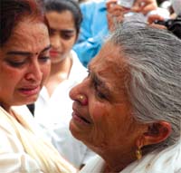 Family members of a victim of the Uphaar tragedy cry during a prayer meeting on the 10th anniversary of the incident in the Capital on Wednesday.