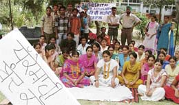 Activists of the ESIC Model Hospital Employees Association observe a relay fast on the third day in Ludhiana on Tuesday.