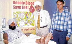 A volunteer donates blood at SPS Apollo Hospital in Ludhiana
