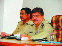 Director general of police R S Dalal (right) and the first Gurgaon commissioner Mohinder Lal during a press conference in Gurgaon on Friday.