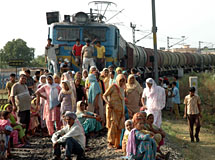 Residents of Kot Ram Das block rail traffic on the Jalandhar cantonment-Pathankot track to protest against the death of a person at an unmanned level crossing near Chaugitti in Jalandhar on Friday.