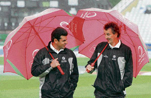 Umpires Aleem Dar (left) and Billy Bowden leave the pitch after deciding to abandon play on the first day of the fourth Test between England and the West Indies at the Riverside, Chester-le-Street, on Friday.